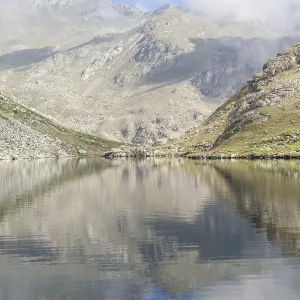 Alpine lake close to the path to the top of Monviso mountain