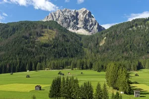 Alpine landscape with green alpine meadows