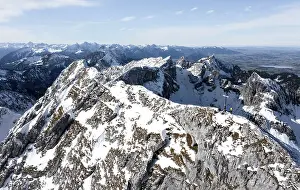Alpine panorama, aerial view, snow-covered mountains in winter