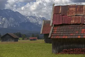 An alpine panorama with several barns