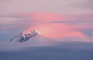 Alpine peaks and clouds in the evening light (Eiger Moench)