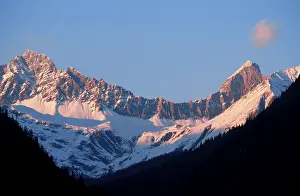 Alps peaks in evening light, Piz Mitgel near Savognin