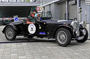 Alvis Crested EAGLE, black classic car with convertible roof at a rally event on cobblestones