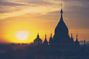 Amazing misty sunrise colors and silhouette of ancient Buddhist Temples at Bagan Kingdom