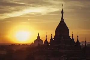 Amazing misty sunrise colors and silhouette of ancient Buddhist Temples at Bagan Kingdom