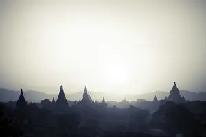 Amazing sunset colors and silhouettes of ancient Buddhist Temples at Bagan Kingdom