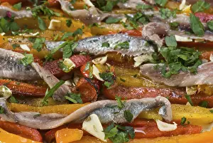 Anchovy fillets with capsicum stripes with garlic
