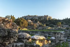 Ancient Agora of Athens Greece captured during sunset hours with the view of Acropolis in the distance