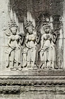 Ancient asian stone carved figures in buddhist angkor wat temple cambodia