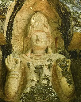 Ancient Bodhisattva statue carved in rock at Kushtarajagala site in Weligama Sri Lanka spiritual heritage site with