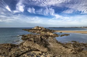 Ancient City Saint-Malo And Coastal Fort Petit Be With Sand Beach In Brittany