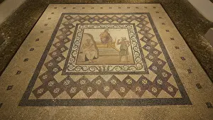 Ancient floor mosaic with complex geometric patterns and figurative depictions