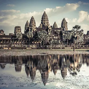 Ancient Khmer architecture. Amazing view of Angkor Thom temple under blue sky