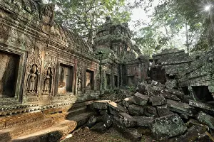 Ancient Khmer architecture. Ta Prohm temple with giant banyan tree at Angkor Wat complex
