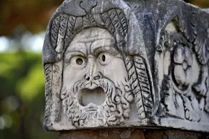 Ancient stone sculpture, stone carving of a mask