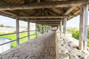 Ancient weathered rough stone walls and tower of the Izborsk fortress