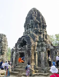 ANGKOR, CAMBODIA - FEB 20, 2013: Unidentified tourists visit Bayon