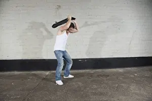 Angry skateboarders wants to break his board