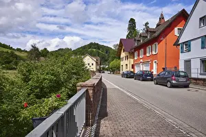 Apartment blocks, hard shoulder with parked cars