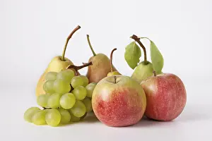 Apples, pears and grapes on a white background