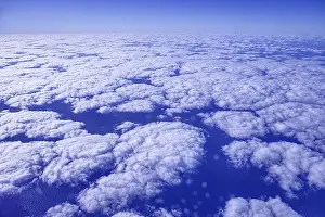 Approach to Arrecife with aerial views of a sea of clouds under a blue sky