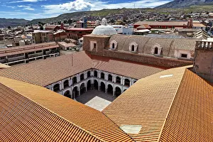 Architectural courtyard of a monastery with tiled roofs in a city