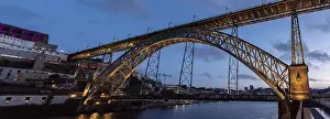 Architectural detail of iconic arched iron bridge Ponte Luis I in the Porto city center at night
