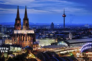 Arial view of the illuminated cologne cathedral and main railway station and many other sights during the blue hour