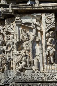 Arjun with bow and arrow carved on hoysaleswara temple