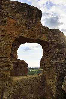 Arkosolium path, necropolis, view through arched niche on coastline and the sea