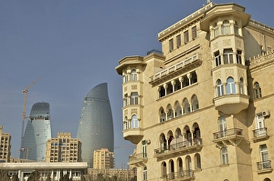 Art Nouveau building on the Bulevar beach promenade in front of the facade of two of the three high-rise