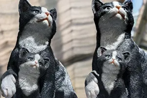 Artificial cats with kittens, as garden decoration in a garden centre