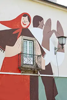 Artistic paintings on old town building facade
