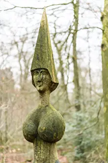 Artistic wooden sculpture with the name Gaia's daughter by artist Wolf E