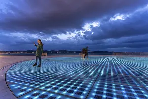 Artwork and solar installation Greeting to the sun at dusk