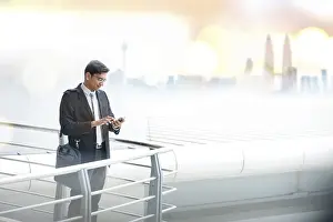 Asian businessman using smartphone