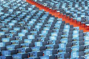 Assembly hall, deserted with many empty chairs and posters with the inscription UNSER KANNZLER