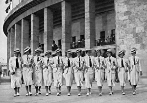 Athletics, the Hungarian female athlete and field athletes arm in arm under the portico of the Olympic Stadium