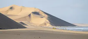 Atlantic coast with high sand dunes and sea in morning light