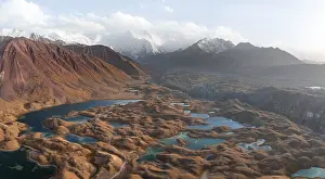 Atmospheric aerial view, high mountain landscape with glacier moraines and mountain lakes