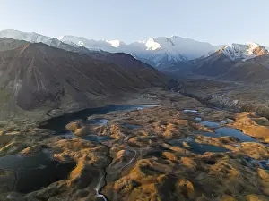 Atmospheric aerial view, high mountain landscape with glacier moraines and mountain lakes