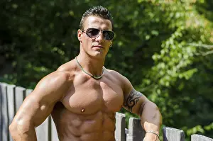 Attractive young muscleman outdoors