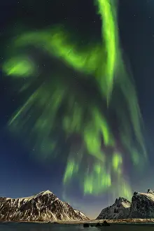 Aurora over the mountains and sea of Lofoten