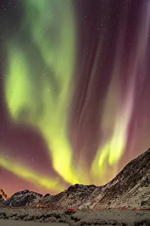 Aurora over the mountains and sea of Lofoten