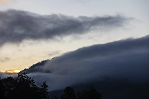 Autumn atmosphere, wafts of mist over a mountain range