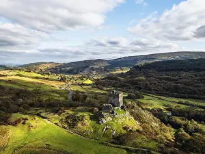 Autumn colours over Castell Dolwyddelan and Eryri Mountains from a drone