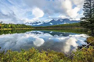 Autumn Herbert Lake, mountains of the Bow Range reflected in the lake