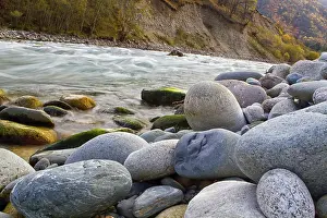 Autumn landscape mountain river mountains covered with colorful vegetation Russian North Caucasus