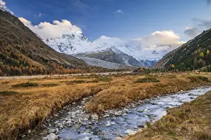 Autumn landscape in Val Roseg, snow-covered mountains