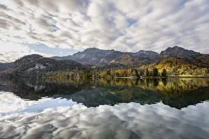 Autumnal mountain landscape with mountain peaks Herzogstand and Heimgarten